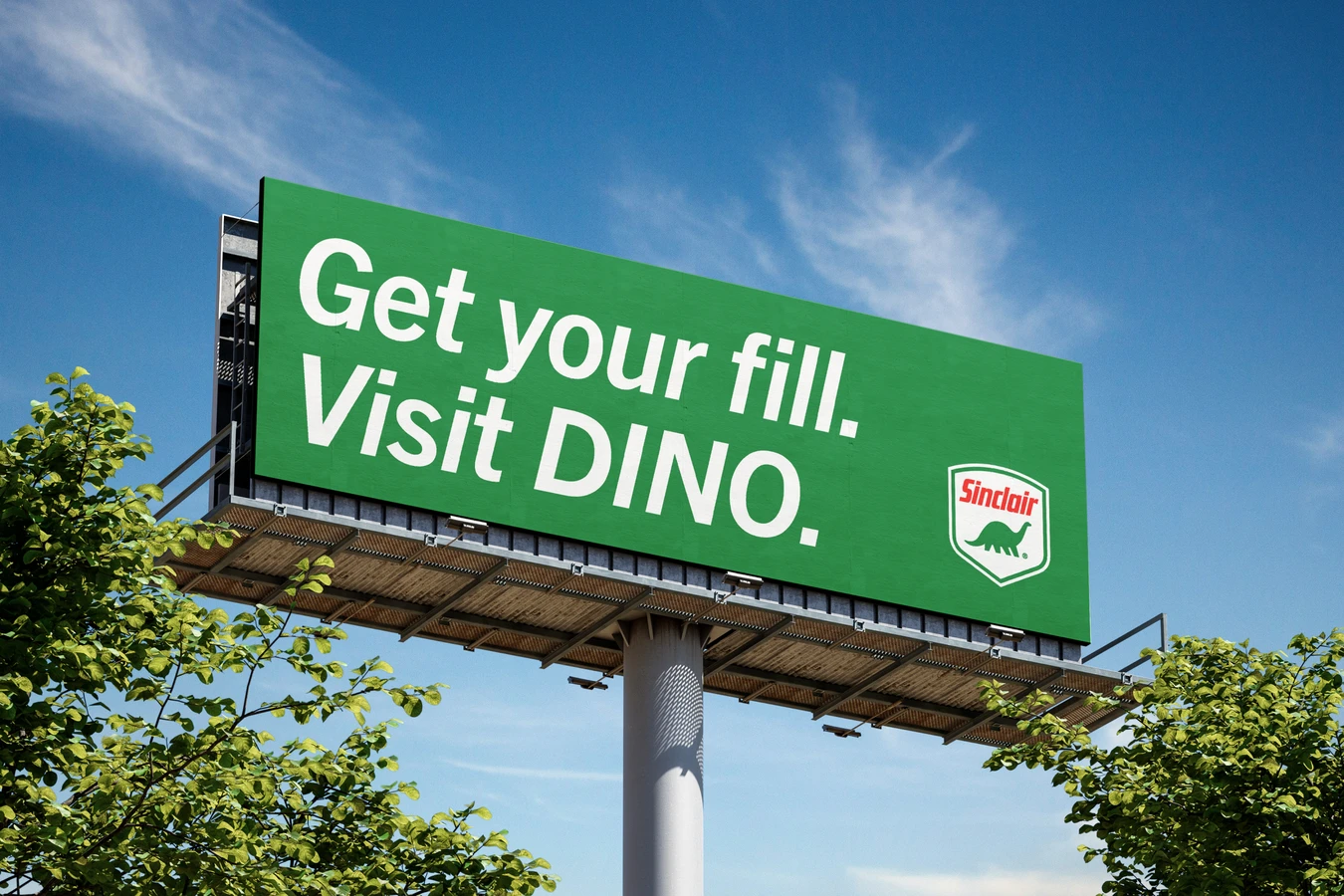 Green billboard on a steel pole against a blue sky with clouds, reading Get your fill. Visit DINO. beside a small Sinclair shield